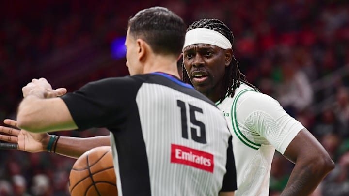Apr 20, 2025; Boston, Massachusetts, USA; Boston Celtics guard Jrue Holiday (4) has words with crew chief Zach Zarba during the second half against the Orlando Magic at TD Garden. Mandatory Credit: Bob DeChiara-Imagn Images