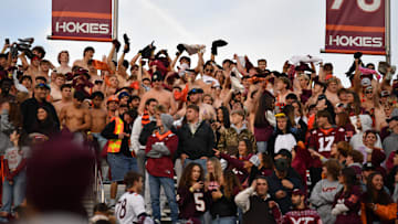 Nov 1, 2025; Blacksburg, Virginia, USA;  Shirtless fans at the Virginia Tech Hokies game against the Louisville Cardinals during the fourth quarter at Lane Stadium. Mandatory Credit: Brian Bishop-Imagn Images