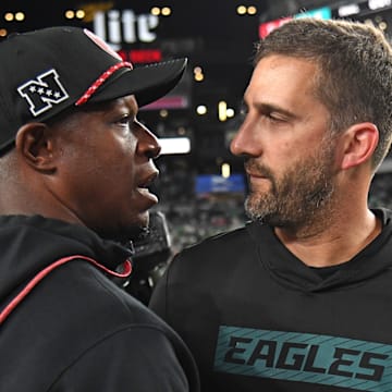 Atlanta Falcons head coach Raheem Morris and Philadelphia Eagles head coach Nick Sirianni meet after Atlanta's 22-21 win.