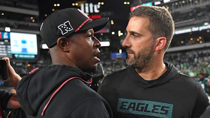 Atlanta Falcons head coach Raheem Morris and Philadelphia Eagles head coach Nick Sirianni meet after Atlanta's 22-21 win.