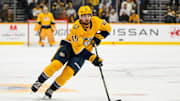 Oct 22, 2024; Nashville, Tennessee, USA;  Nashville Predators defenseman Alexandre Carrier (45) skates with the puck against the Boston Bruins uring the third period at Bridgestone Arena. Mandatory Credit: Steve Roberts-Imagn Images