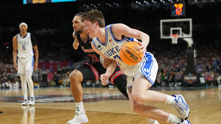 Duke Blue Devils guard Kon Knueppel (7) drives against Houston Cougars guard Emanuel Sharp (21) in the semifinals of the men's Final Four of the 2025 NCAA Tournament at the Alamodome. 