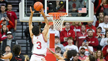 Dec 29, 2024; Bloomington, Indiana, USA;  Indiana Hoosiers guard Anthony Leal (3) scores past Winthrop Eagles guard Paul Jones III (3) during the second half at Simon Skjodt Assembly Hall. Mandatory Credit: Robert Goddin-Imagn Images