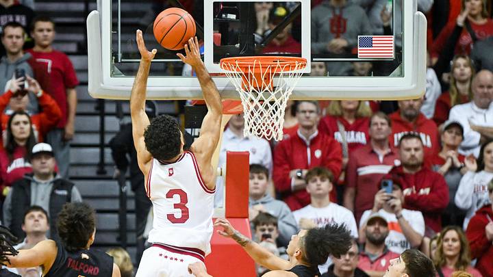 Dec 29, 2024; Bloomington, Indiana, USA;  Indiana Hoosiers guard Anthony Leal (3) scores past Winthrop Eagles guard Paul Jones III (3) during the second half at Simon Skjodt Assembly Hall. Mandatory Credit: Robert Goddin-Imagn Images