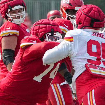 Jul 26, 2024; Kansas City, MO, USA; Kansas City Chiefs offensive tackle Jawaan Taylor (74) and defensive tackle Chris Jones (95) run drills during training camp at Missouri Western State University. Mandatory Credit: Denny Medley-USA TODAY Sports