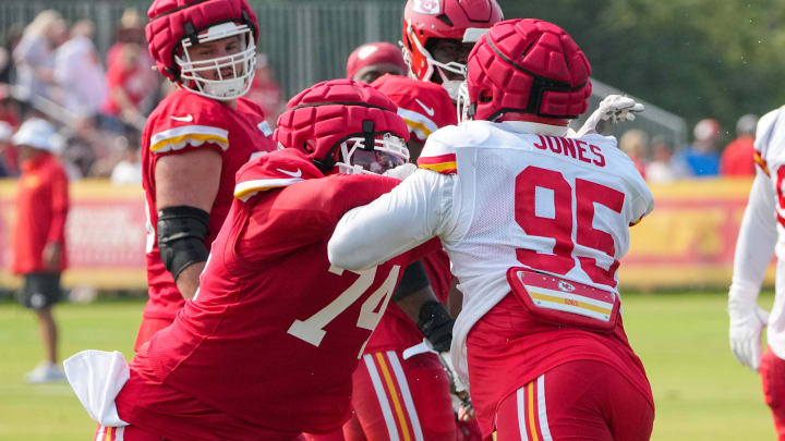 Jul 26, 2024; Kansas City, MO, USA; Kansas City Chiefs offensive tackle Jawaan Taylor (74) and defensive tackle Chris Jones (95) run drills during training camp at Missouri Western State University. Mandatory Credit: Denny Medley-USA TODAY Sports