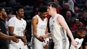Cincinnati Bearcats guard Simas Lukosius (41) is embraced by his teammates after returning to the bench in the second half of a NCAA men’s basketball game between the Cincinnati Bearcats and Texas Tech Red Raiders, Tuesday, Jan. 21, 2025, at Fifth Third Arena in Cincinnati. Red Raiders won 81-71.