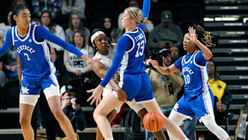 Vanderbilt guard Jordyn Oliver (11) passes the ball as Kentucky center Clara Strack (13) defends during an NCAA college basketball game Sunday, Jan. 5, 2025, in Nashville, Tenn.