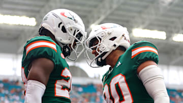 Nov 2, 2024; Miami Gardens, Florida, USA; Miami Hurricanes place kicker Andres Borregales (30) celebrates with wide receiver Robby Washington (28) against the Duke Blue Devils during the fourth quarter at Hard Rock Stadium. Mandatory Credit: Sam Navarro-Imagn Images