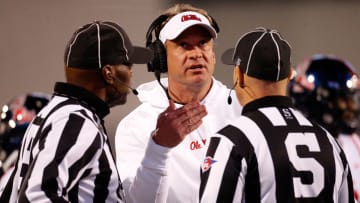 Nov 23, 2023; Starkville, Mississippi, USA; Mississippi Rebels head coach Lane Kiffin talks with the referees during the second half against the Mississippi State Bulldogs at Davis Wade Stadium at Scott Field. Mandatory Credit: Petre Thomas-USA TODAY Sports