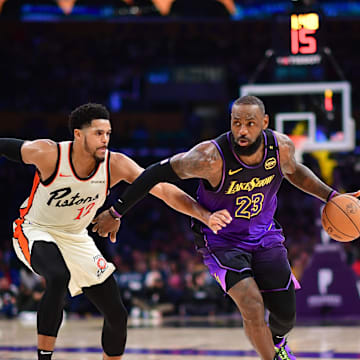 Dec 23, 2024; Los Angeles, California, USA; Los Angeles Lakers forward LeBron James (23) moves the ball against Detroit Pistons forward Tobias Harris (12) during the second half at Crypto.com Arena. Mandatory Credit: Gary A. Vasquez-Imagn Images