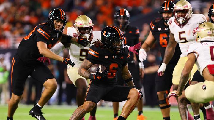 Oct 26, 2024; Miami Gardens, Florida, USA; Miami Hurricanes running back Damien Martinez (6) runs with the football against the Florida State Seminoles during the second quarter at Hard Rock Stadium. Mandatory Credit: Sam Navarro-Imagn Images