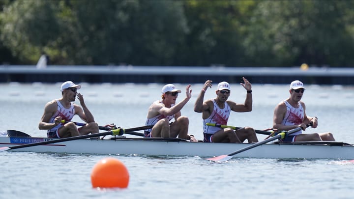 Christian Tabash and the USA men's eight crew after winning their heat 