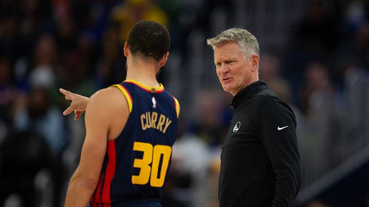 San Francisco, California, USA; Golden State Warriors head coach Steve Kerr confers with guard Stephen Curry (30)  during the second quarter against the Sacramento Kings at Chase Center. Mandatory Credit: D. Ross Cameron-Imagn Images