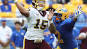 Sep 6, 2025; Pittsburgh, Pennsylvania, USA;  Central Michigan Chippewas quarterback Jadyn Glasser (15) passes against pressure from Pittsburgh Panthers defensive lineman Isaiah Neal (2) during the fourth quarter at Acrisure Stadium. Mandatory Credit: Charles LeClaire-Imagn Images