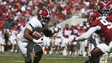 Apr 13, 2024; Tuscaloosa, AL, USA;  Alabama running back Daniel Hill (20) looks for room to run as he is pursued by Alabama defensive lineman Jeremiah Beaman (92) during the A-Day scrimmage at Bryant-Denny Stadium. Mandatory Credit: Gary Cosby Jr.-Imagn Images