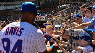 Mar 23, 2022; Mesa, Arizona, USA; Chicago Cubs right fielder Brennen Davis (94) signs autographs for