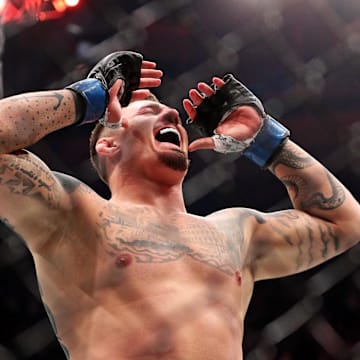 Nov 11, 2023; New York, NY, USA; Tom Aspinall (blue gloves) reacts to beating Sergei Pavlovich (red gloves) during UFC 295 at Madison Square Garden. Mandatory Credit: Wendell Cruz-Imagn Images