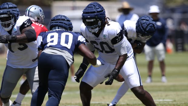 Dallas Cowboys offensive tackle Tyler Guyton (60) blocks during training camp 