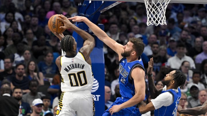 Mar 5, 2024; Dallas, Texas, USA; Indiana Pacers guard Bennedict Mathurin (00) is fouled by Dallas Mavericks forward Maxi Kleber (42) during the second quarter at the American Airlines Center. Mandatory Credit: Jerome Miron-USA TODAY Sports