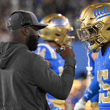 Sep 28, 2024; Pasadena, California, USA; UCLA Bruins head coach DeShaun Foster talks to Oregon Ducks at the Rose Bowl. Mandatory Credit: Robert Hanashiro-Imagn Images