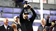 Jan 3, 2025; Dallas, TX, USA; Texas State Bobcats head coach GJ Kinne celebrates with the trophy after the game against the North Texas Mean Green at Gerald J. Ford Stadium. Mandatory Credit: Tim Heitman-Imagn Images