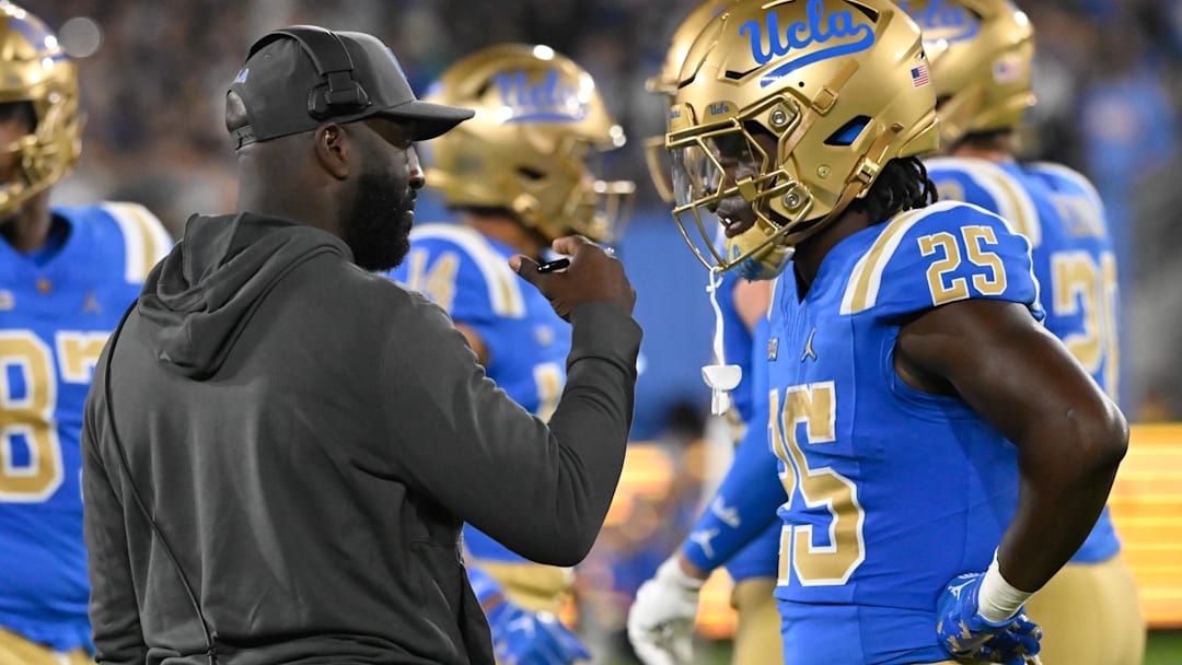 Sep 28, 2024; Pasadena, California, USA; UCLA Bruins head coach DeShaun Foster talks to Oregon Ducks at the Rose Bowl. Mandatory Credit: Robert Hanashiro-Imagn Images