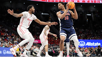 Arizona Wildcats forward Tobe Awaka guarded by Houston Cougars forward Ja'Vier Francis during the Big 12 Championship.
