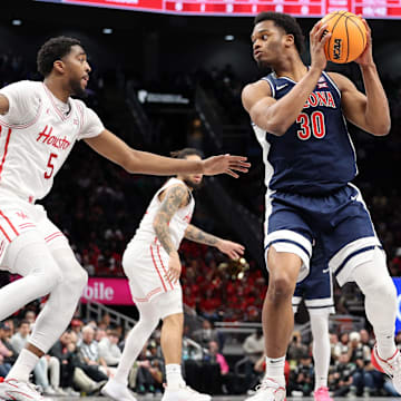Arizona Wildcats forward Tobe Awaka guarded by Houston Cougars forward Ja'Vier Francis during the Big 12 Championship.