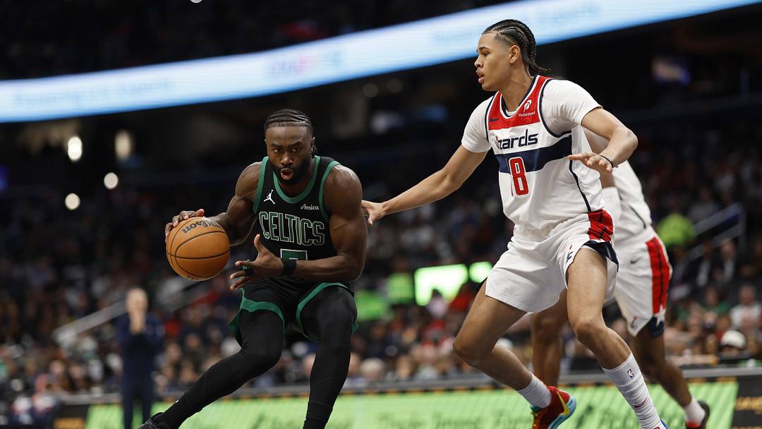 Oct 24, 2024; Washington, District of Columbia, USA; Boston Celtics guard Jaylen Brown (7) drives to the basket as Washington Wizards forward Kyshawn George (18) defends in the first half at Capital One Arena. Mandatory Credit: Geoff Burke-Imagn Images