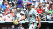 Arkansas Razorbacks starting pitcher Gage Wood (14) looks at the scoreboard.