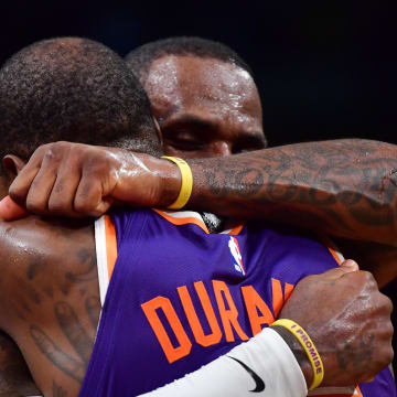 Oct 26, 2023; Los Angeles, California, USA; Phoenix Suns forward Kevin Durant (35) meets with Los Angeles Lakers forward LeBron James (23) following the game at Crypto.com Arena. Mandatory Credit: Gary A. Vasquez-USA TODAY Sports