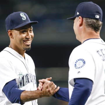 Seattle Mariners relief pitcher Edwin Diaz shakes hands with manager Scott Servais on Sept. 19, 2018, at T-Mobile Park.