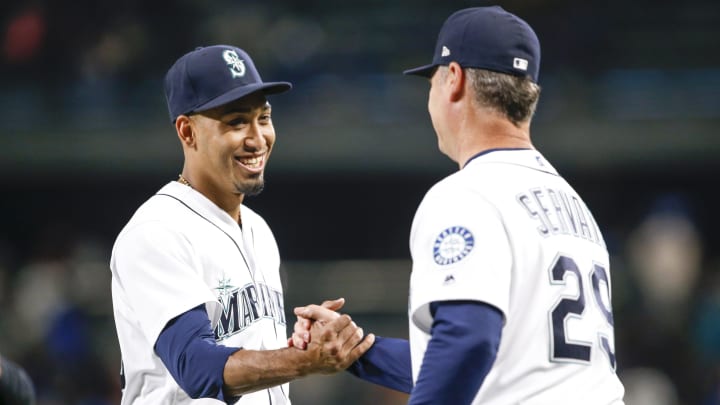 Seattle Mariners relief pitcher Edwin Diaz shakes hands with manager Scott Servais on Sept. 19, 2018, at T-Mobile Park.