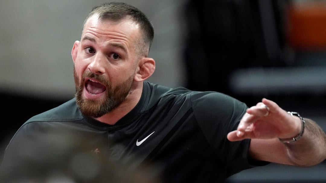 Oklahoma State coach David Taylor gestures during a Bedlam wrestling dual between the Oklahoma State Cowboys (OSU) and the University of Oklahoma Sooners (OU) at Gallagher-Iba in Stillwater, Okla., Sunday, Jan. 11, 2026.
