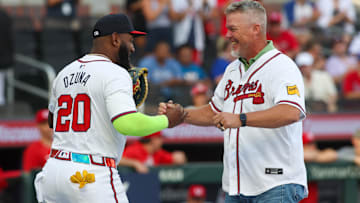 Jul 22, 2024; Atlanta, Georgia, USA; Former Atlanta Braves third baseman Chipper Jones (10) talks to designated hitter Marcell Ozuna (20) after throwing out the first pitch against the Cincinnati Reds at Truist Park. Mandatory Credit: Brett Davis-Imagn Images
