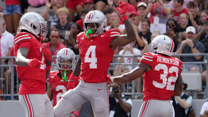 August 31, 2024; Columbus, Ohio, USA;
Ohio State Buckeyes wide receiver Jeremiah Smith (4) celebrates after scoring a touchdown during the first half of Saturday’s NCAA Division I football game against the Akron Zips at Ohio Stadium.