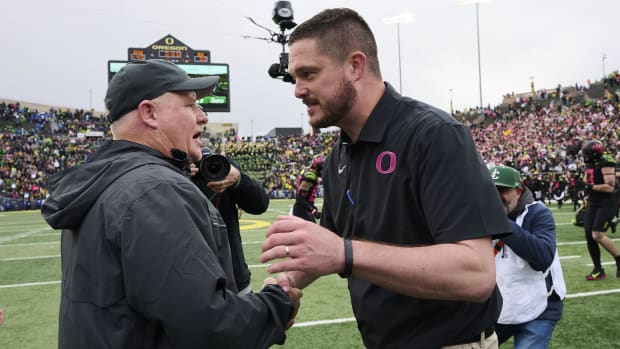 UCLA Bruins head coach Chip Kelly, left, congratulates Oregon Ducks head coach Dan Lanning after a game at Autzen Stadium. Th