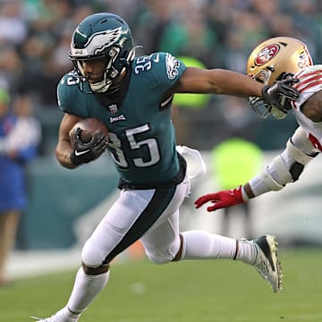 Jan 29, 2023; Philadelphia, Pennsylvania, USA; Philadelphia Eagles running back Boston Scott (35) carries the ball against San Francisco 49ers linebacker Dre Greenlaw (57) during the second quarter in the NFC Championship game at Lincoln Financial Field. Mandatory Credit: Bill Streicher-Imagn Images