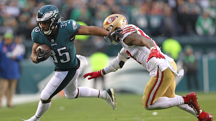 Jan 29, 2023; Philadelphia, Pennsylvania, USA; Philadelphia Eagles running back Boston Scott (35) carries the ball against San Francisco 49ers linebacker Dre Greenlaw (57) during the second quarter in the NFC Championship game at Lincoln Financial Field. Mandatory Credit: Bill Streicher-Imagn Images