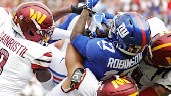 Sep 7, 2025; Landover, Maryland, USA; New York Giants wide receiver Wan'Dale Robinson (17) is tackled during the first quarter against the Washington Commanders at Northwest Stadium. Mandatory Credit: Amber Searls-Imagn Images