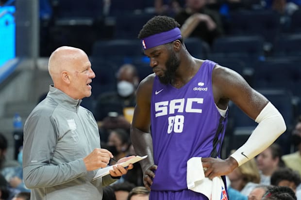 Deputy coach of the Sacramento Kings, Jay Triano, speaks to the Neemias Queta Center