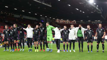Bayern Munich players celebrating with fans after defeating Manchester United at Old Trafford on matchday six of the Champions League.