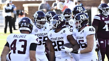 Oct 17, 2020; Starkville, Mississippi, USA; Texas A&M Aggies running back Isaiah Spiller (28) reacts with teammates after a touchdown against the Mississippi State Bulldogs during the second quarter at Davis Wade Stadium at Scott Field. Mandatory Credit: Matt Bush-Imagn Images