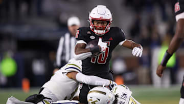 Nov 21, 2024; Atlanta, Georgia, USA; North Carolina State Wolfpack wide receiver Kevin Concepcion (10) runs the ball against the Georgia Tech Yellow Jackets in the first quarter at Bobby Dodd Stadium at Hyundai Field. Mandatory Credit: Brett Davis-Imagn Images