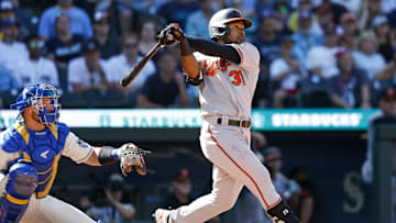 Aug 13, 2023; Seattle, Washington, USA; Baltimore Orioles center fielder Cedric Mullins (31) hits a ball against the Seattle Mariners