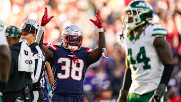 Oct 27, 2024; Foxborough, Massachusetts, USA; New England Patriots running back Rhamondre Stevenson (38) reacts after his touchdown is confirmed against the New York Jets in the second half at Gillette Stadium. Mandatory Credit: David Butler II-Imagn Images