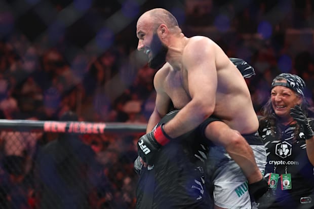 Azamat Murzakanov (red gloves) reacts after defeating Brendson Ribeiro (not pictured) during UFC 316 at Prudential Center. 