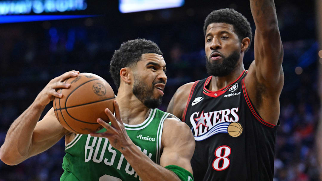 Apr 24, 2026; Philadelphia, Pennsylvania, USA; Boston Celtics forward Jayson Tatum (0) drives to the basket  against Philadelphia 76ers forward Paul George (8) during the first half at Xfinity Mobile Arena. Mandatory Credit: Eric Hartline-Imagn Images