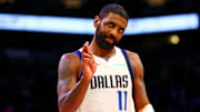 Dec 27, 2024; Phoenix, Arizona, USA; Dallas Mavericks guard Kyrie Irving (11) reacts after a play during the first quarter against the Phoenix Suns at Footprint Center. Mandatory Credit: Mark J. Rebilas-Imagn Images